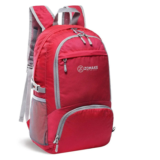 Hopvikbar Reseryggsäck i röd färg med stor kapacitet och vattentåligt material. Idealisk för äventyr och stadspromenader.