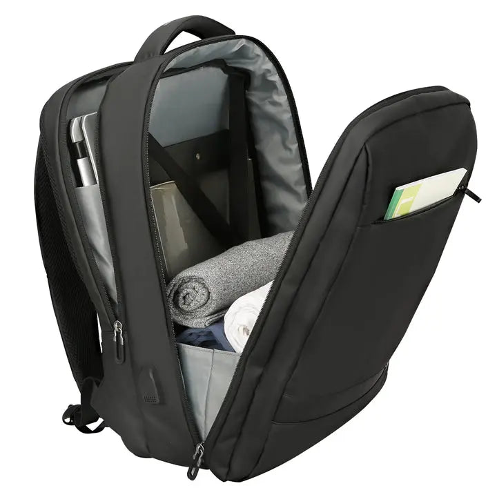 Liten reseryggsäck med rymliga fack för laptop, kläder och viktiga researtiklar